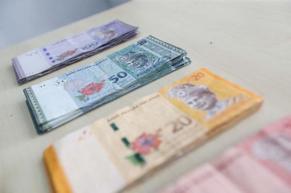 Ringgit opens firmer against greenback ahead of GDP announcement